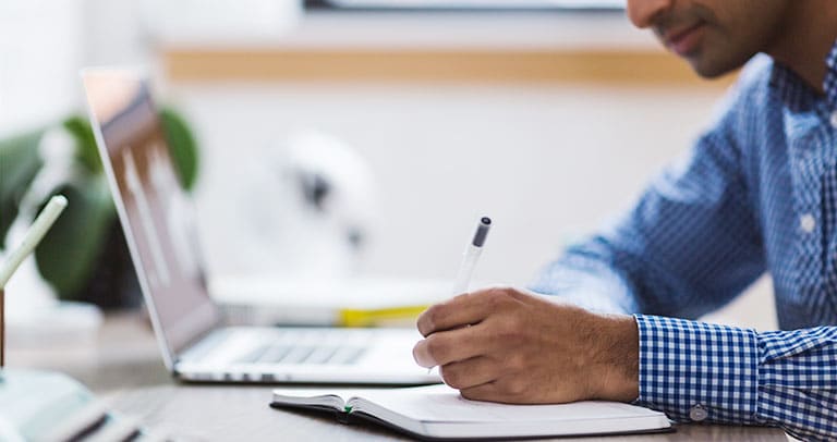 man working on a desk promotion strategy importance