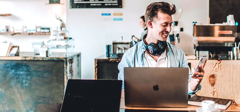 blogger smiling at a cafe