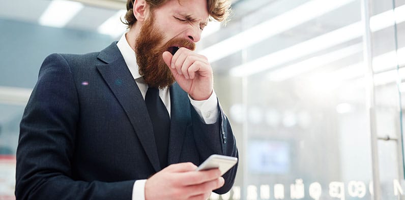 bored worker holding phone