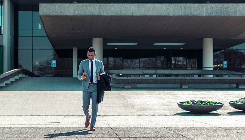 man walking out of a building