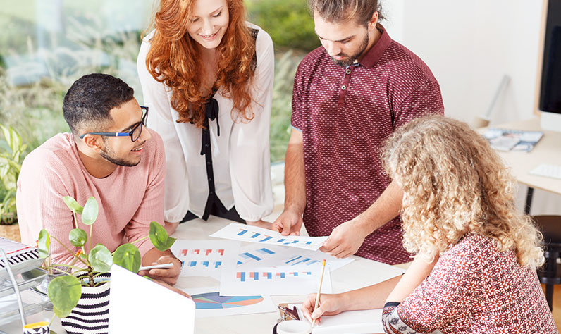 office workers reviewing charts