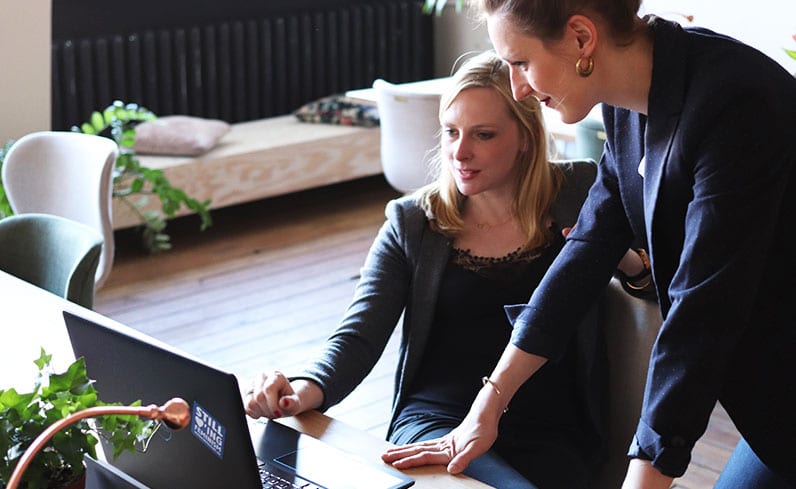 woman boss talking with woman employee