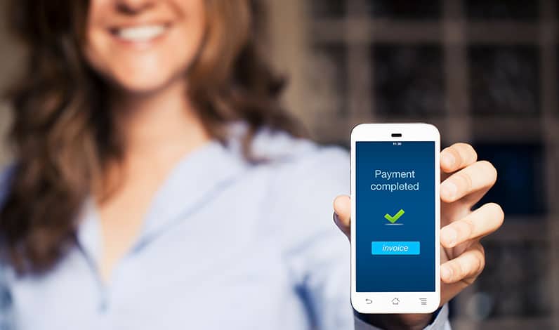 happy woman holding phone payment