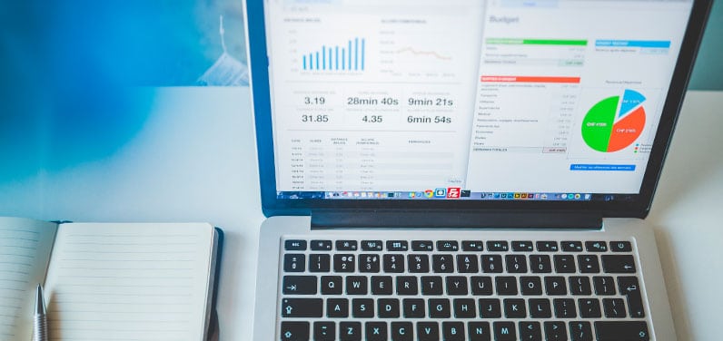 laptop on table showing amalytics