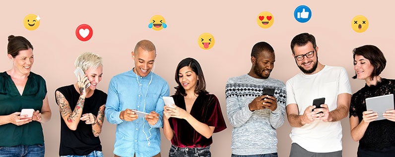 group of people smiling using their phones