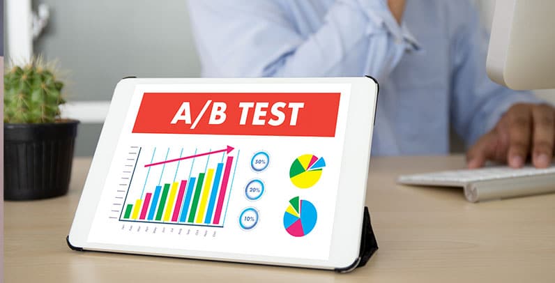 tablet on table showing ab test and man behind