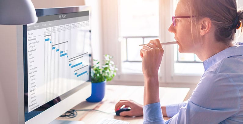 woman looking at screen showing timetable