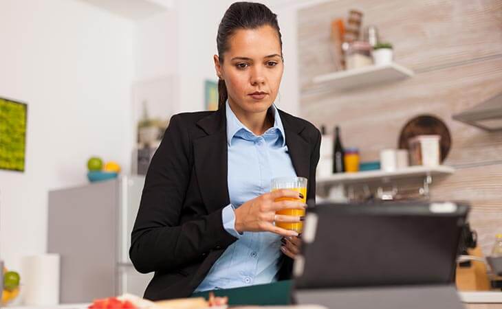 woman juice watching tablet