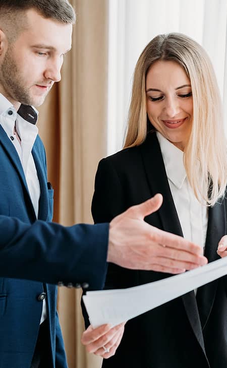 business man and business woman with a document
