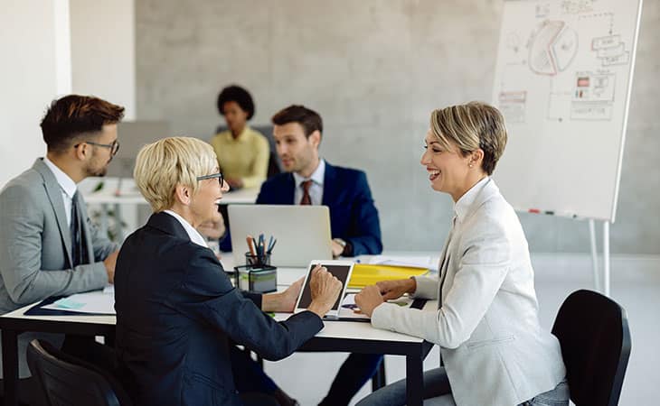 Job Descriptions For Executives (With Template &Amp; Examples) Evinex Corporation | Staffing Agency group of coworkers working