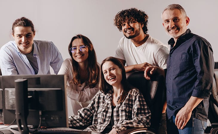 group of people in front of the computer