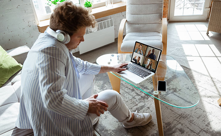 man in a virtual meeting working from home