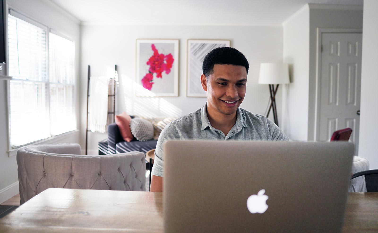 smiling-man-using-laptop