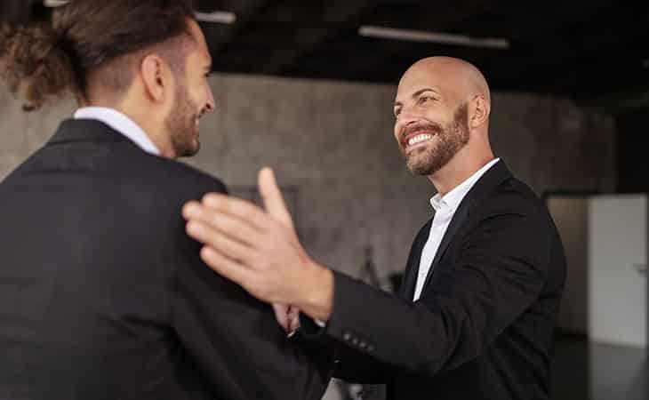 100+ Interview Questions For Executives With Sample Answers Evinex Corporation | Staffing Agency two happy businessmen