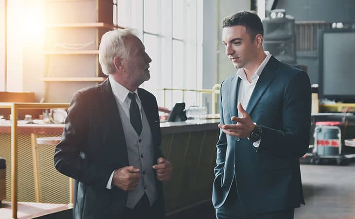100+ Interview Questions For Executives With Sample Answers Evinex Corporation | Staffing Agency two men talking