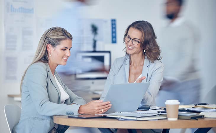 100+ Interview Questions For Executives With Sample Answers Evinex Corporation | Staffing Agency two women in a job interview