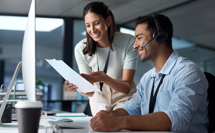 couple-working-computer-headset