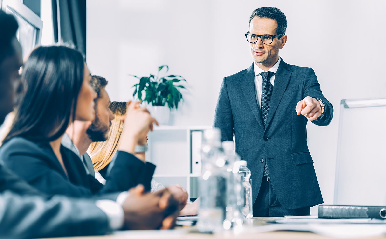 Job Description For Directors: Sample, Tips &Amp; Templates Evinex Corporation | Staffing Agency director-pointing-meeting