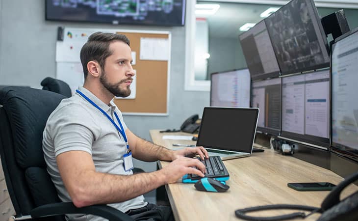 engineer-working-computer-screens