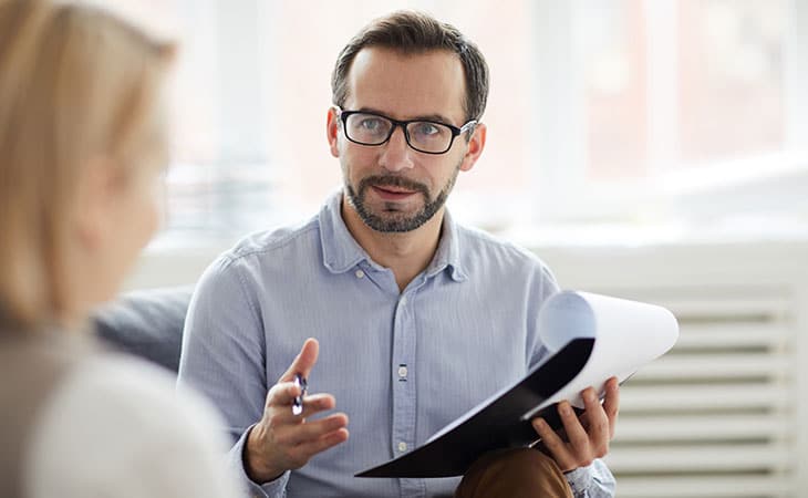 man-documents-talking-women