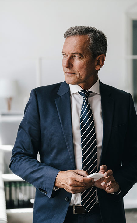Job Description For Directors: Sample, Tips &Amp; Templates Evinex Corporation | Staffing Agency man-suit-looking-away