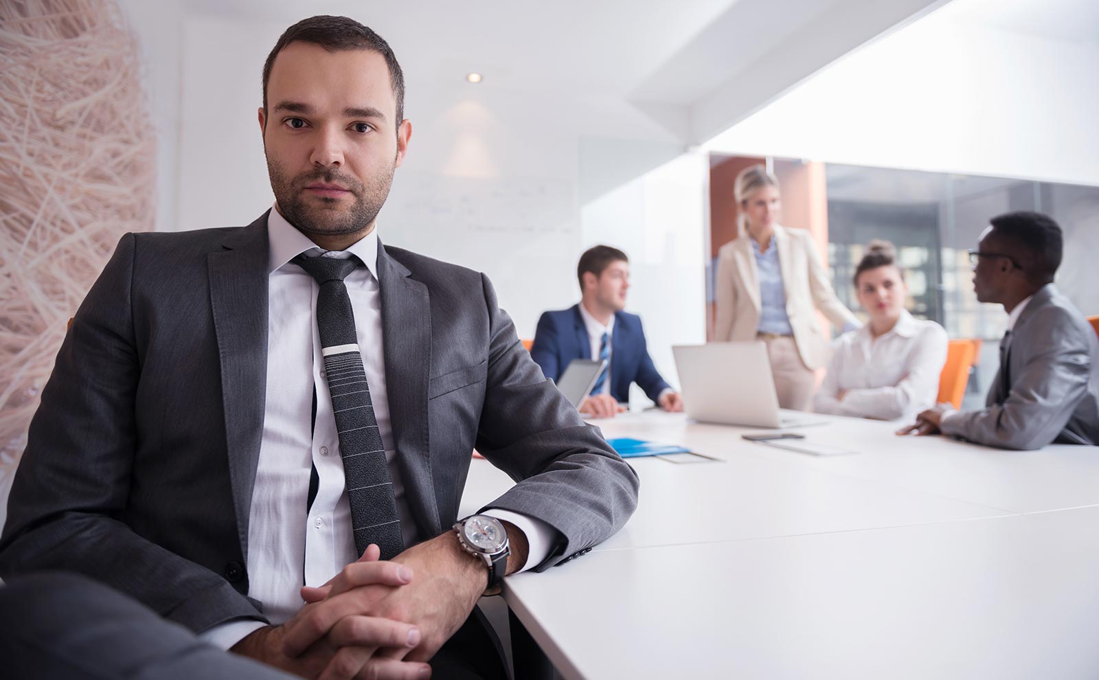 man-suit-looking-camera-people-meeting