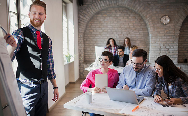100+ Interview Questions For Product Managers + Answers Evinex Corporation | Staffing Agency man-teaching-people