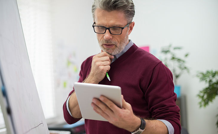 Job Description For Directors: Sample, Tips &Amp; Templates Evinex Corporation | Staffing Agency man-thinking-hand-chin-tablet