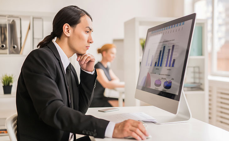 100+ Interview Questions For Product Managers + Answers Evinex Corporation | Staffing Agency man-thinking-looking-statistics-screen