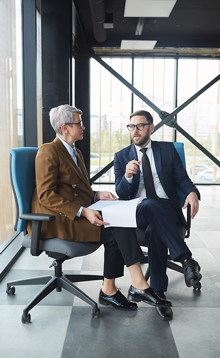 100+ Interview Questions For Managers &Amp; Interview Answers Evinex Corporation | Staffing Agency man-woman-talking-chair-indoors