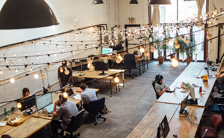 office-people-computers-lamps-tables