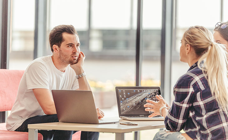100+ Interview Questions For Product Managers + Answers Evinex Corporation | Staffing Agency people-sitting-table-laptops