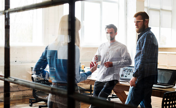 100+ Interview Questions For Product Managers + Answers Evinex Corporation | Staffing Agency three-people-meeting-office