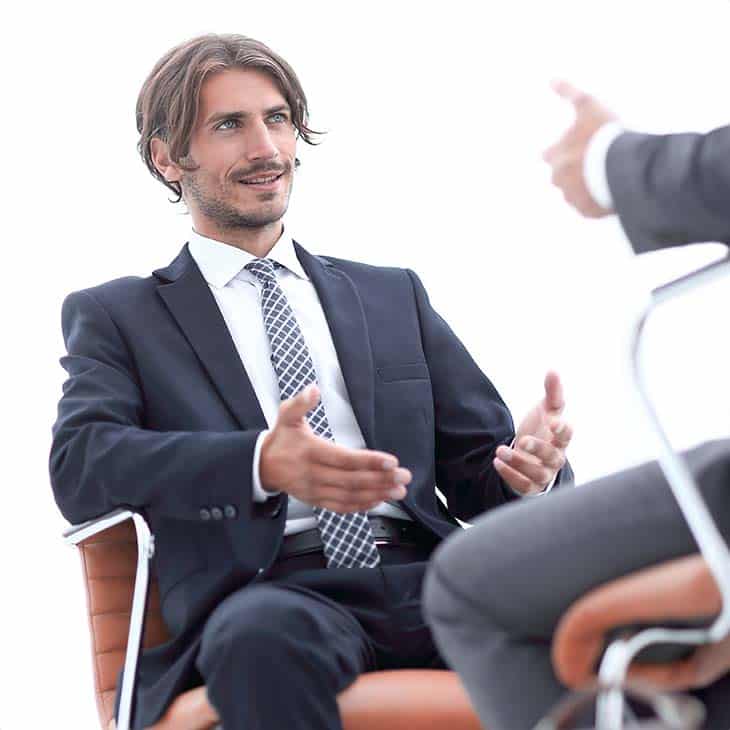 100+ Director Interview Questions - What To Ask + Answers Evinex Corporation | Staffing Agency two-cusinessmen-talking-chair