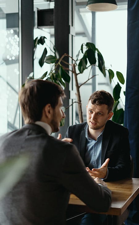 100+ Director Interview Questions - What To Ask + Answers Evinex Corporation | Staffing Agency two-men-conversation