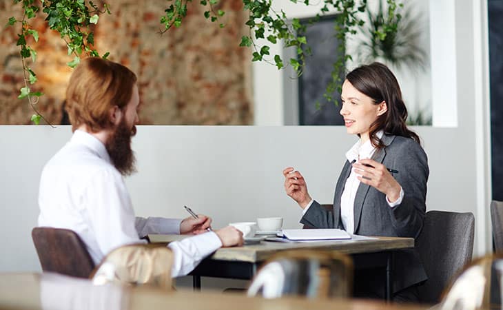 two-women-talking-interview-office