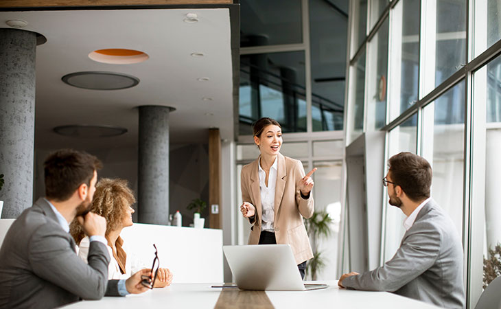 Job Description For Directors: Sample, Tips &Amp; Templates Evinex Corporation | Staffing Agency woman-speech-office-meeting