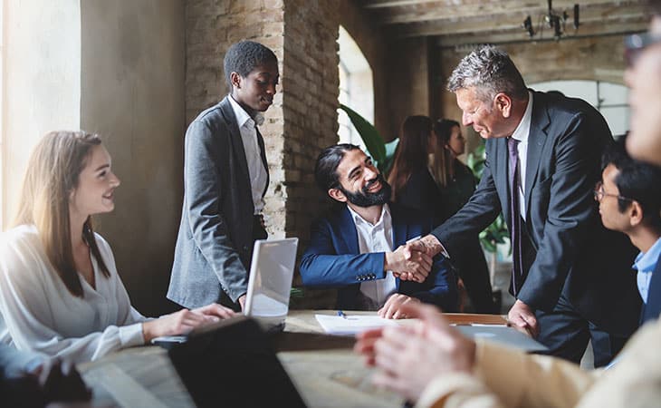100+ Program Manager Interview Questions To Find Top Talent Evinex Corporation | Staffing Agency executive-people-meeting-handshake
