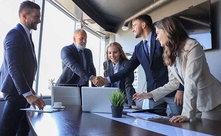 100+ Program Manager Interview Questions To Find Top Talent Evinex Corporation | Staffing Agency executive-people-meeting-handshake