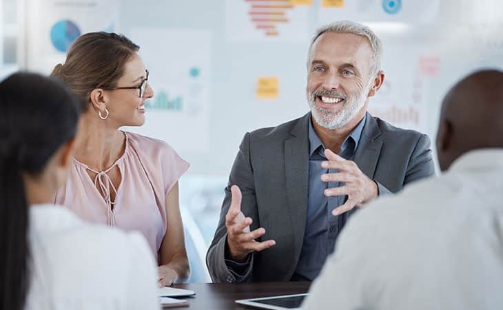 100+ Program Manager Interview Questions To Find Top Talent Evinex Corporation | Staffing Agency man-explaining-meeting
