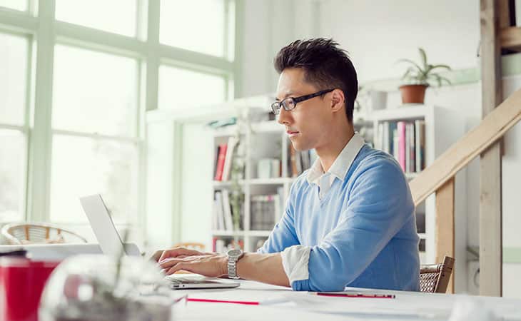 man-using-laptop-home-office