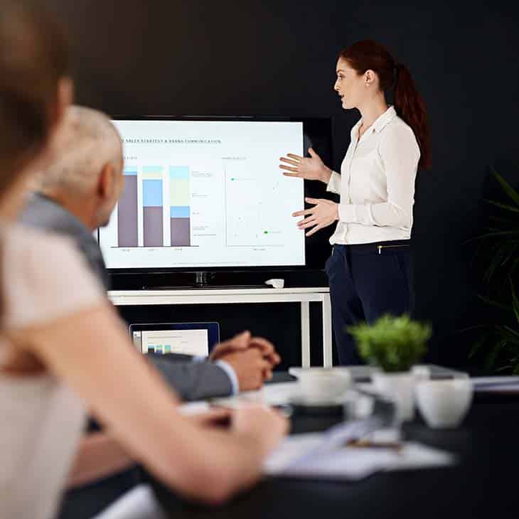 100+ Program Manager Interview Questions To Find Top Talent Evinex Corporation | Staffing Agency woman-presentation-data-screen