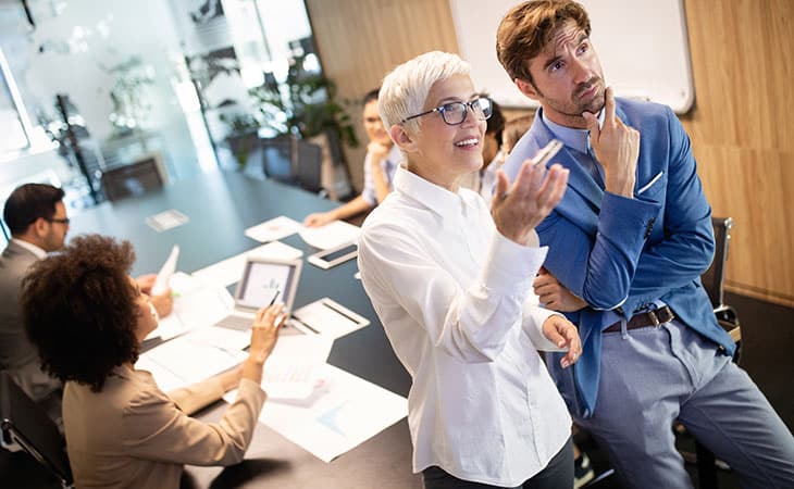 100+ Program Manager Interview Questions To Find Top Talent Evinex Corporation | Staffing Agency workers-thinking-meeting