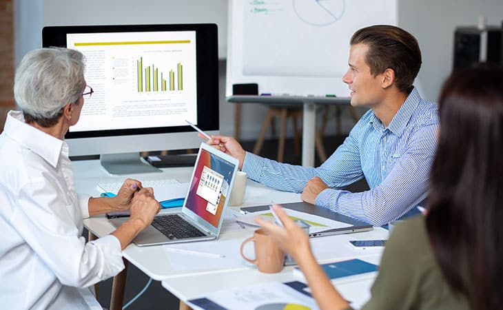 100+ Interview Questions To Identify Top Product Owners Evinex Corporation | Staffing Agency man-pointing-screen-statistics