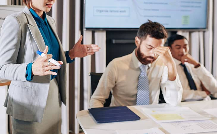 100+ Interview Questions To Identify Top Product Owners Evinex Corporation | Staffing Agency meeting-woman-talking-man-hand-nose