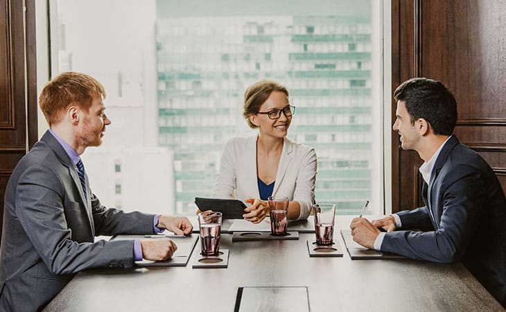 100+ Interview Questions To Identify Top Product Owners Evinex Corporation | Staffing Agency three-executives-meeting