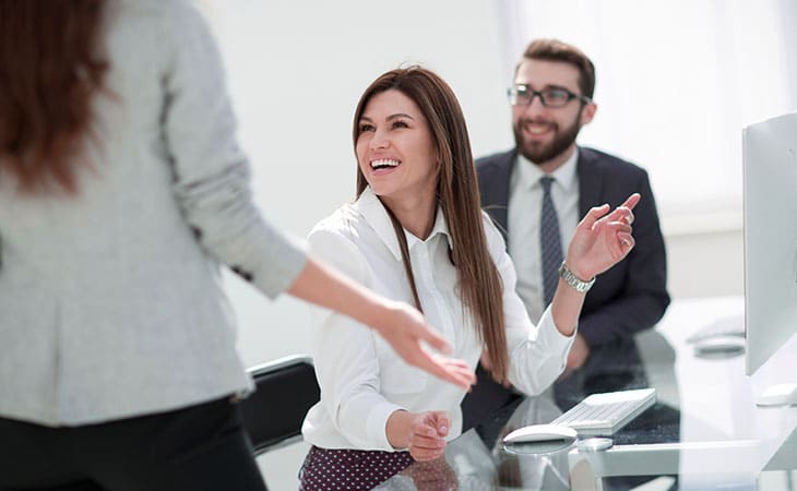 Mastering Interpersonal Skills: Your Guide To Success Evinex Corporation | Staffing Agency a smiling woman in an office