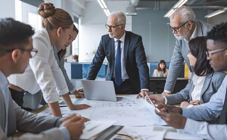 group of business workers discussing an issue