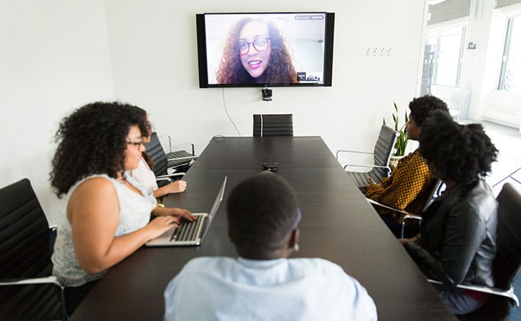 Mastering Interpersonal Skills: Your Guide To Success Evinex Corporation | Staffing Agency people in an office in a video call