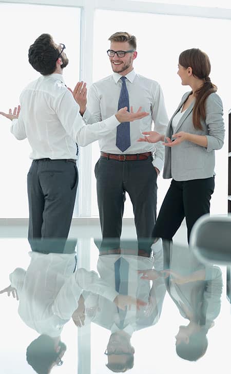 Mastering Interpersonal Skills: Your Guide To Success Evinex Corporation | Staffing Agency three people in an office making gestures while talking